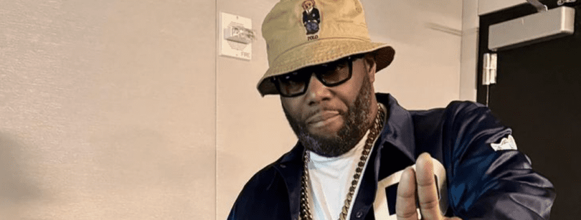 Man wearing sunglasses and hat indoors.